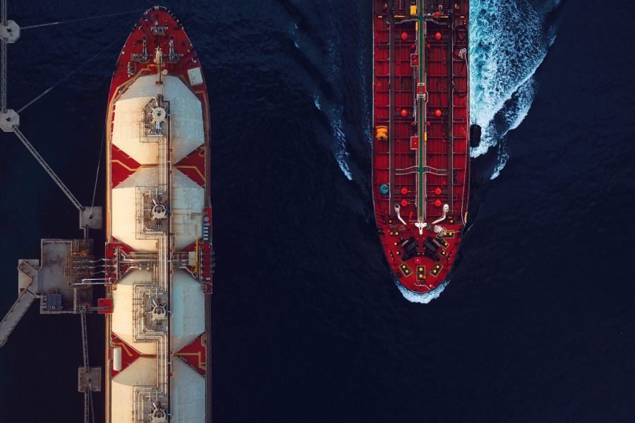 Aerial view of two ships, one docked